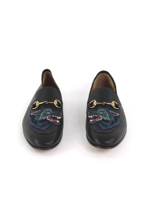 Brown loafers with a blue wolf