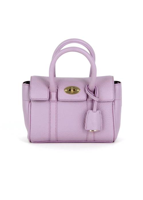 Pink leather bag with gold jewellery