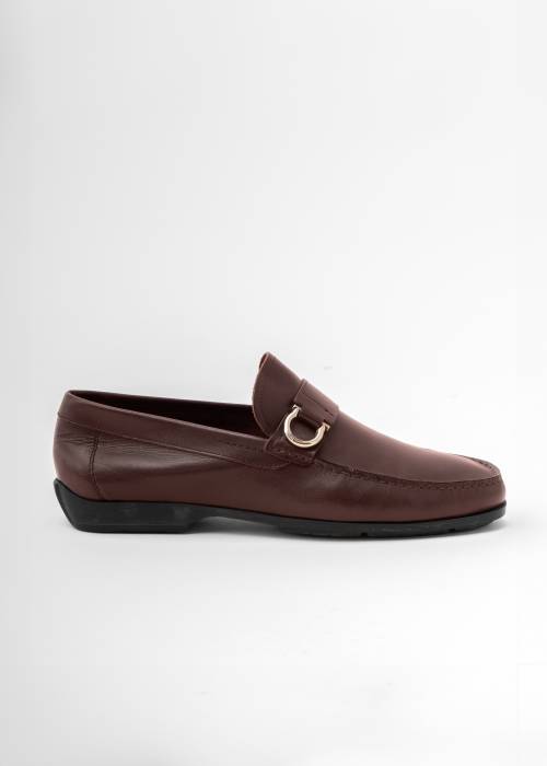 Brown leather loafers with silver buckle