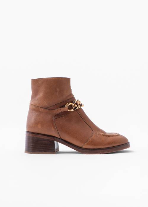 Brown leather boots with gold chain