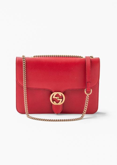 Red leather bag with gold jewelry