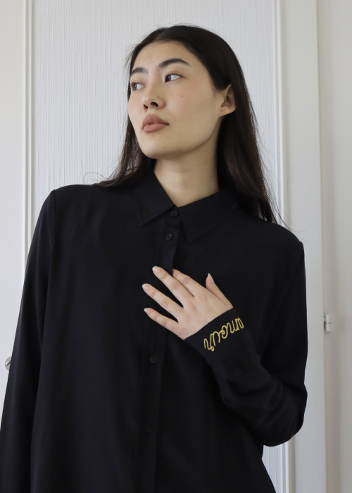 Black shirt with "love" embroidered in metallic thread