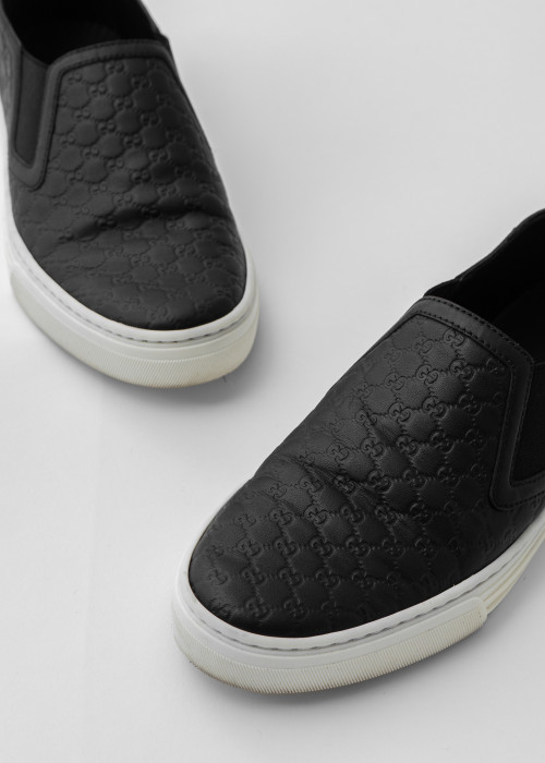 Black leather slip-on sneakers