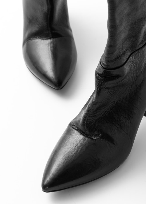 High pointed-toe boots