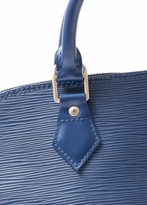 Alma PM blue bag in herringbone leather