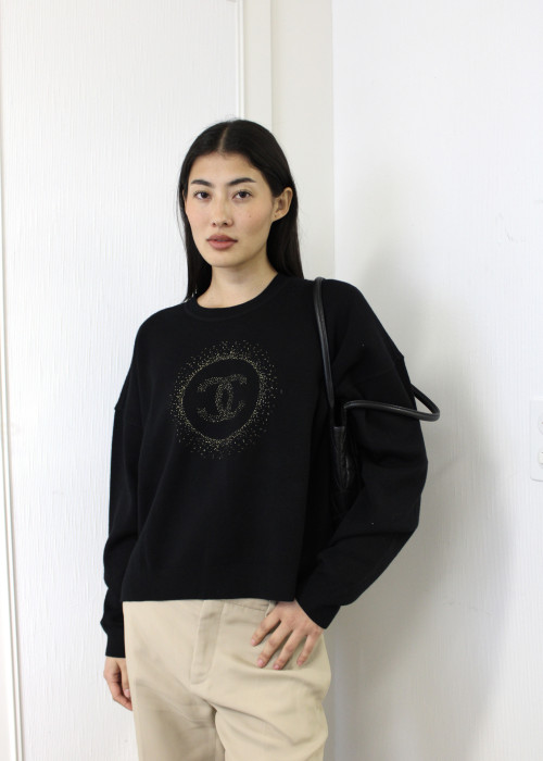 Black sweater with gold logo