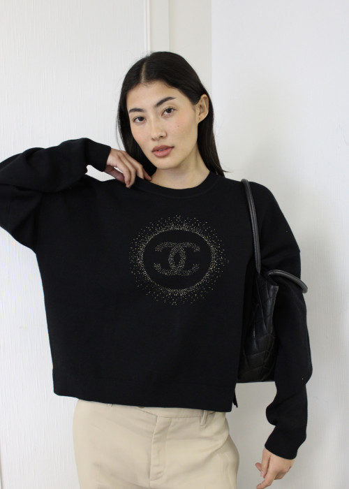 Black sweater with gold logo