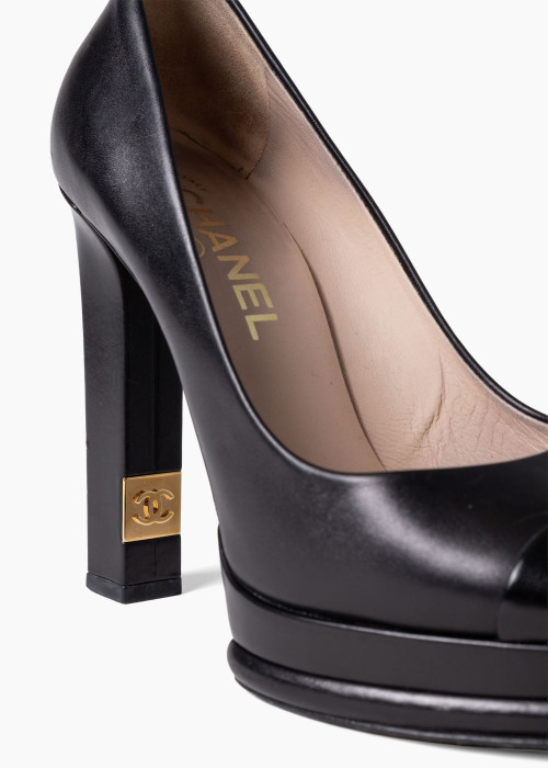 Black leather platform pumps