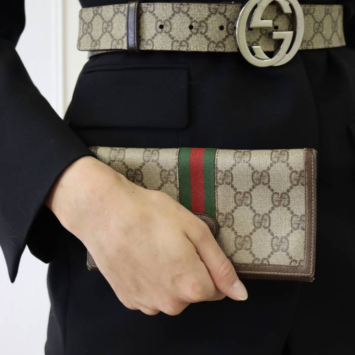 Porte-monnaie en tissu et cuir Gucci