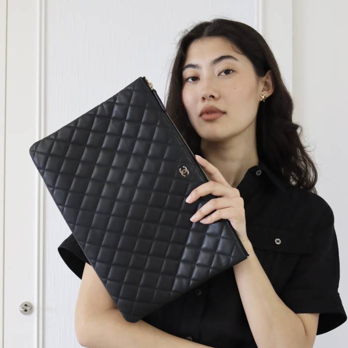 Quilted black leather clutch bag Chanel