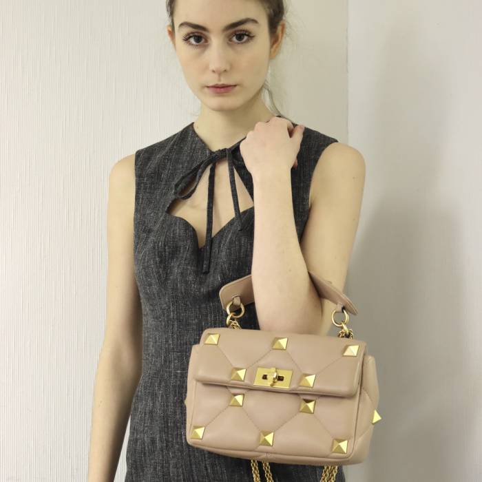 Beige leather bag with gold jewelry Valentino