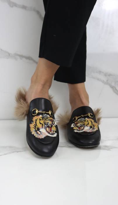 Leather and faux fur mules Gucci