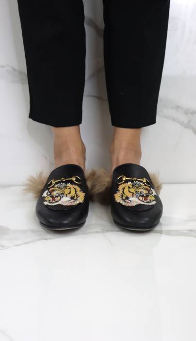 Leather and faux fur mules Gucci