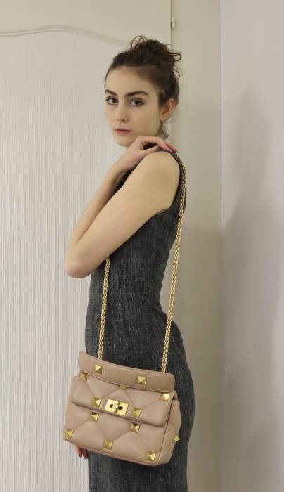 Beige leather bag with gold jewelry Valentino
