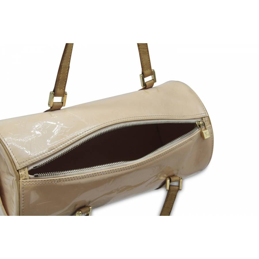Round patent leather handbag