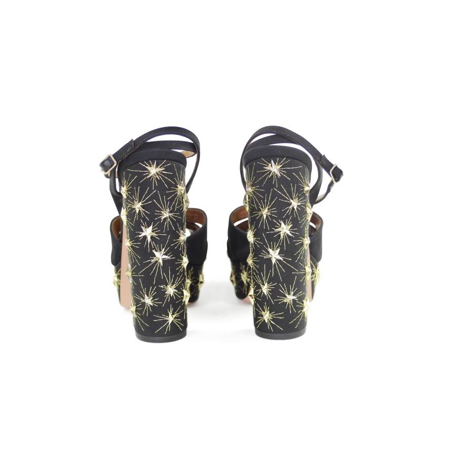 Black heels with gold stars