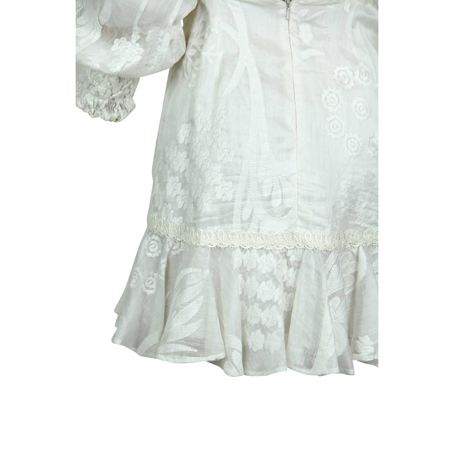 White dress with long sleeves and embroidery