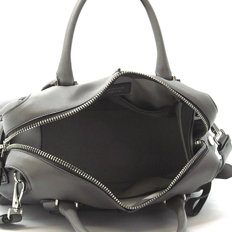 Grey leather bag with silver jewellery