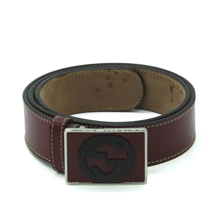 Red leather belt with red and black buckle