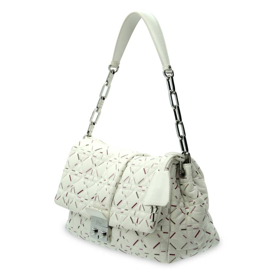 White leather bag with red and pink touches