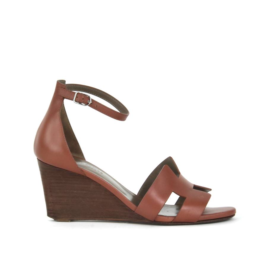 Pair of leather wedge sandals
