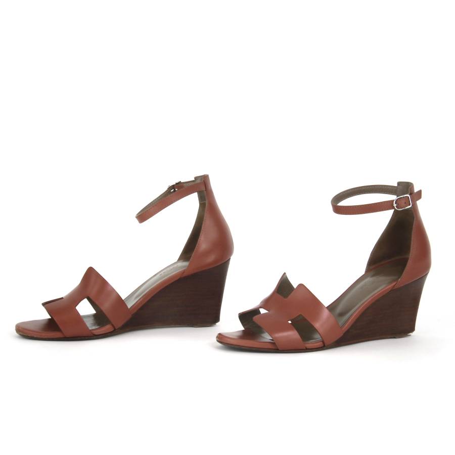 Pair of leather wedge sandals