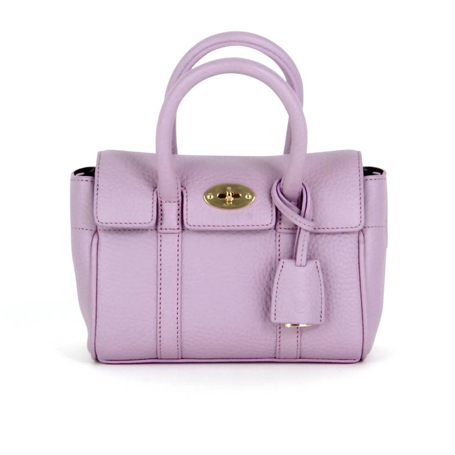 Pink leather bag with gold jewellery