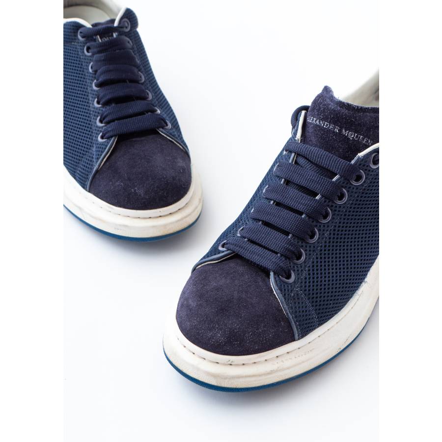 Navy blue and white leather sneakers