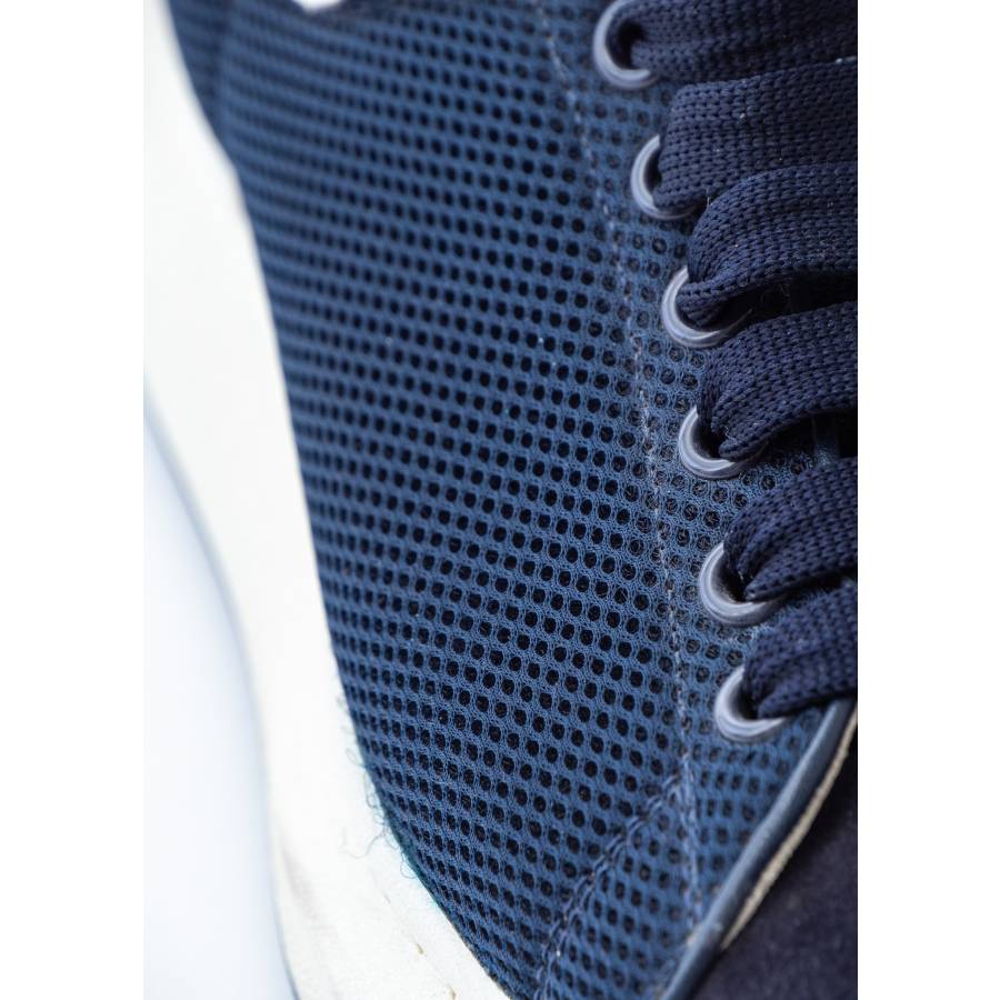 Navy blue and white leather sneakers
