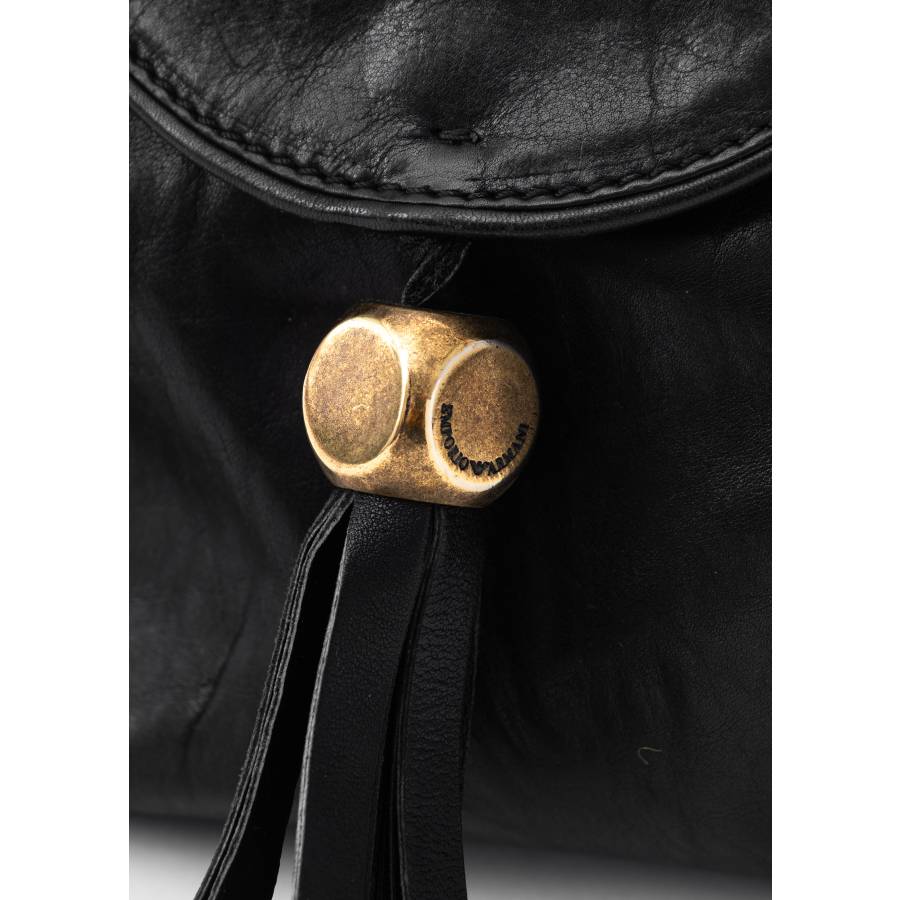 Black leather bag with gold jewelry