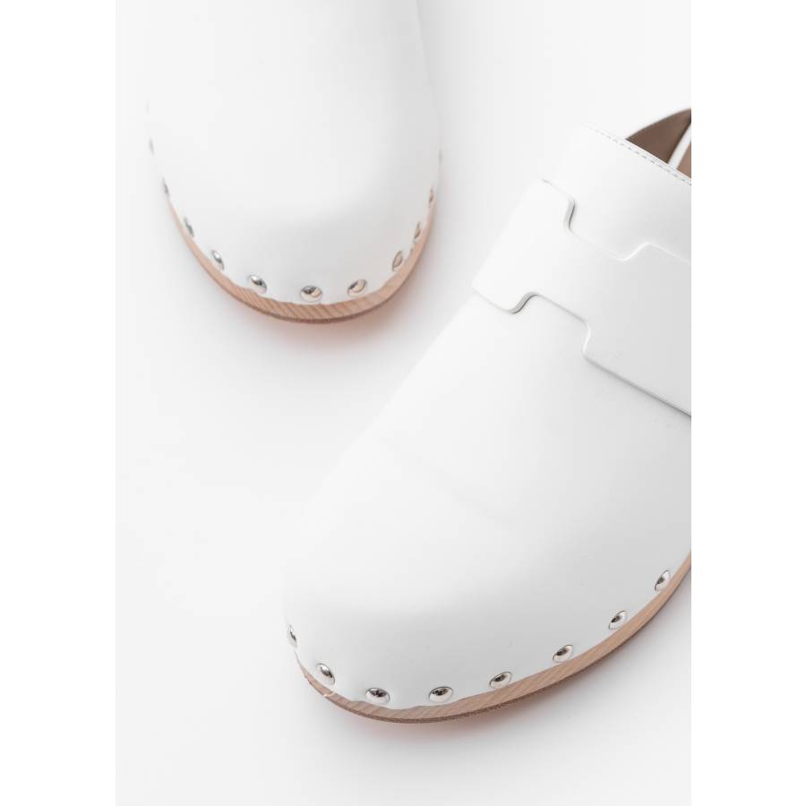Calya mules in white leather