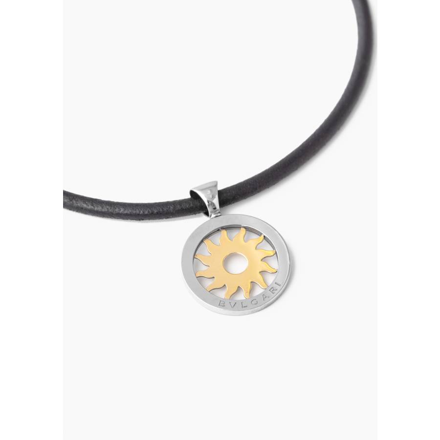 Soleil pendant in yellow gold and steel