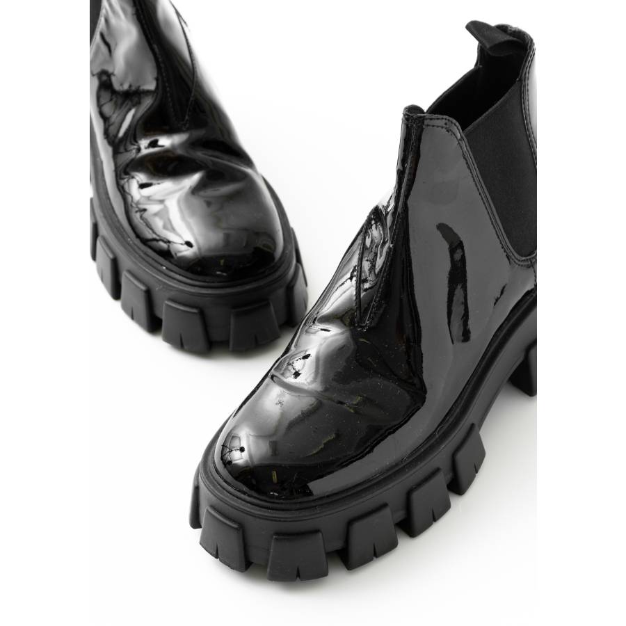 Monolith black patent leather boots