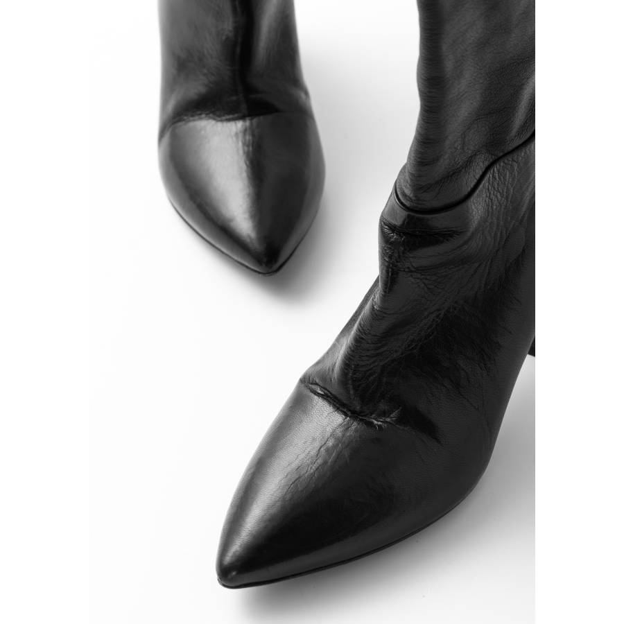 High pointed-toe boots