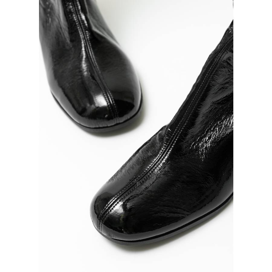 Bottes cuissardes noires en cuir vernis