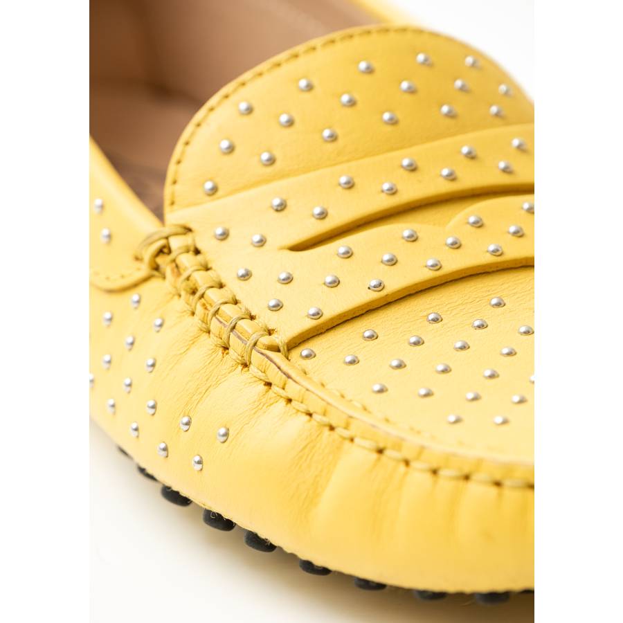 Yellow moccasins with studs