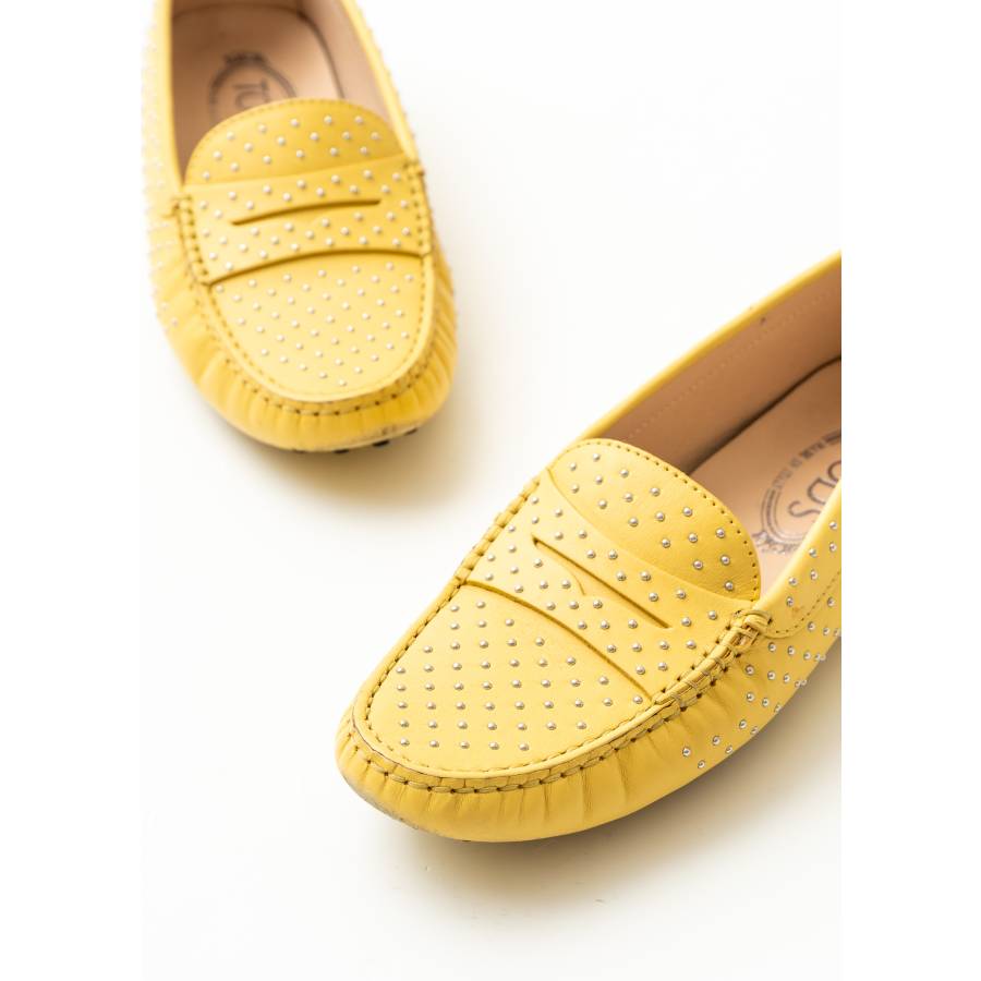 Yellow moccasins with studs