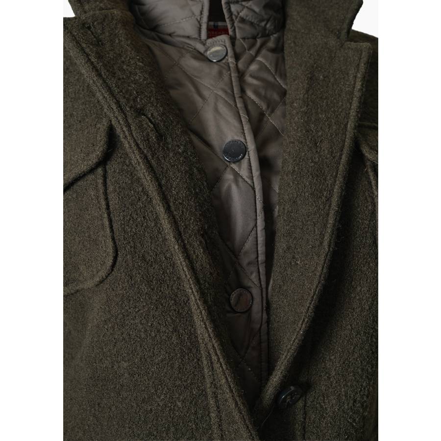 Veste en laine avec gilet matelassé intégré.