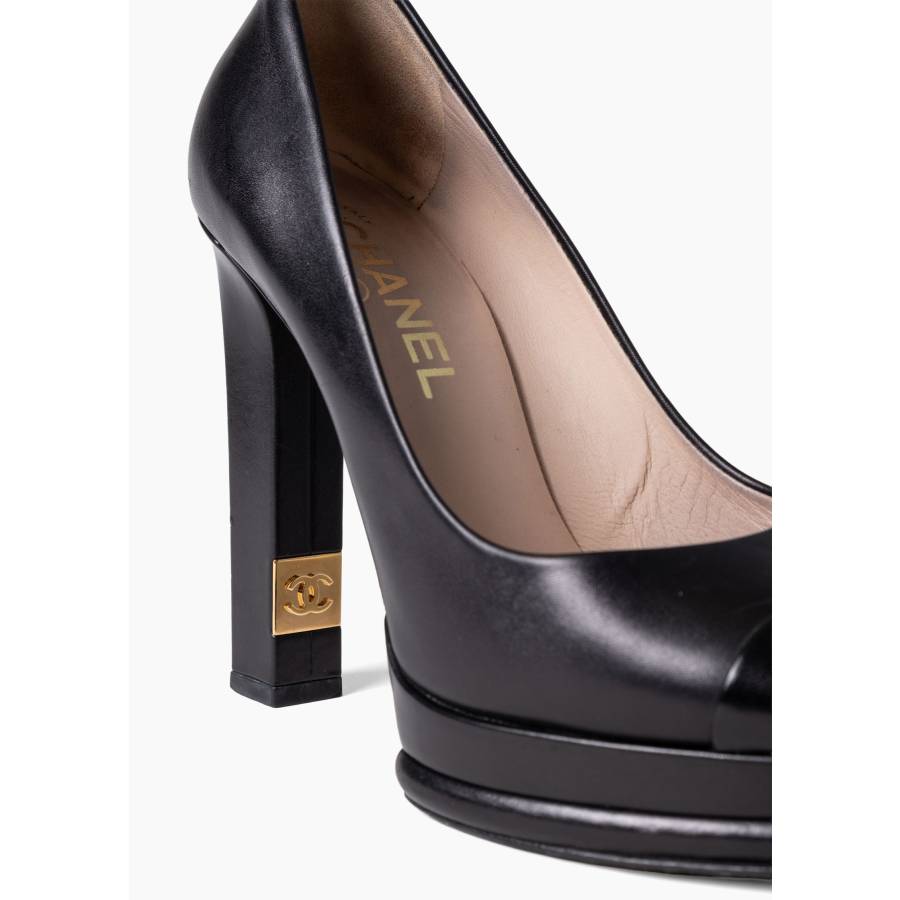 Black leather platform pumps